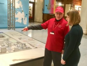 On duty in the lobby, Harvey points out interesting buildings on the Chicago model. Photo/Hoffmann