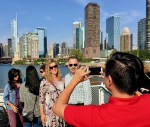 In DuSable Harbor, Hau takes photos of tourees on the river photography tour. (Photo/Hoffmann)